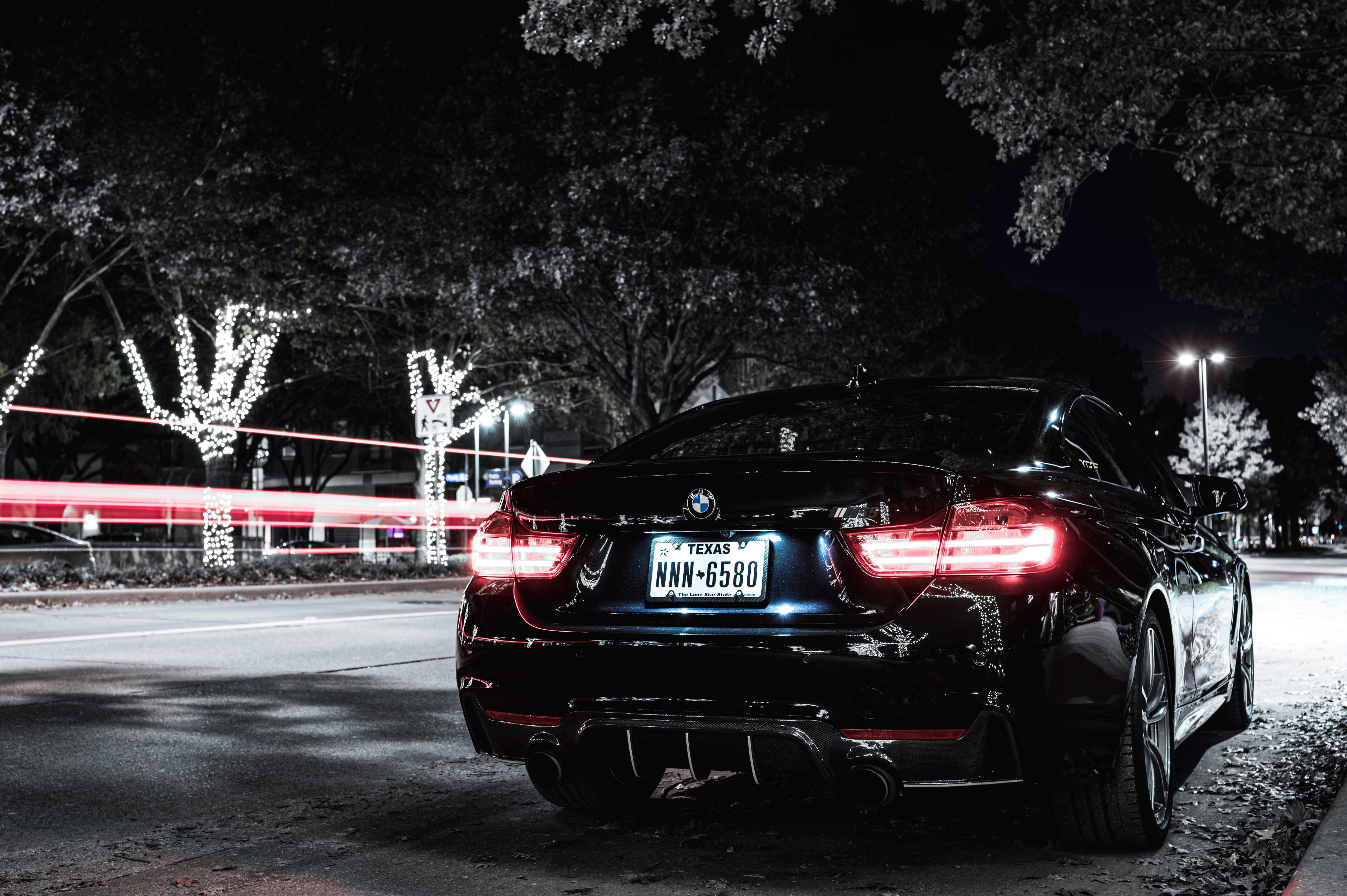 black bmw car on road