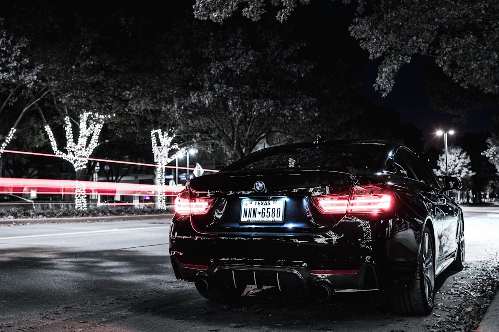 black bmw car on road