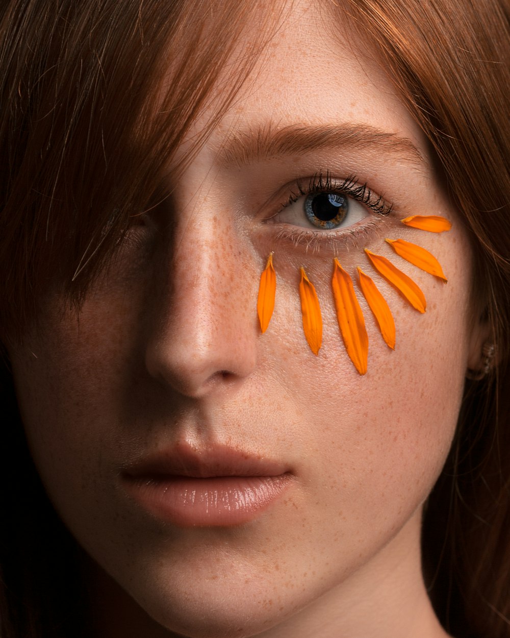 woman with orange hair clip