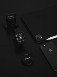 space gray iphone 6 beside black smartwatch