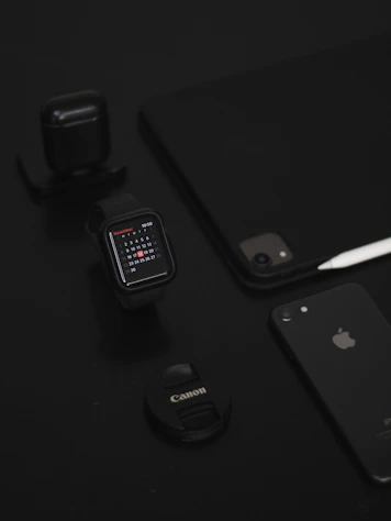 space gray iphone 6 beside black smartwatch