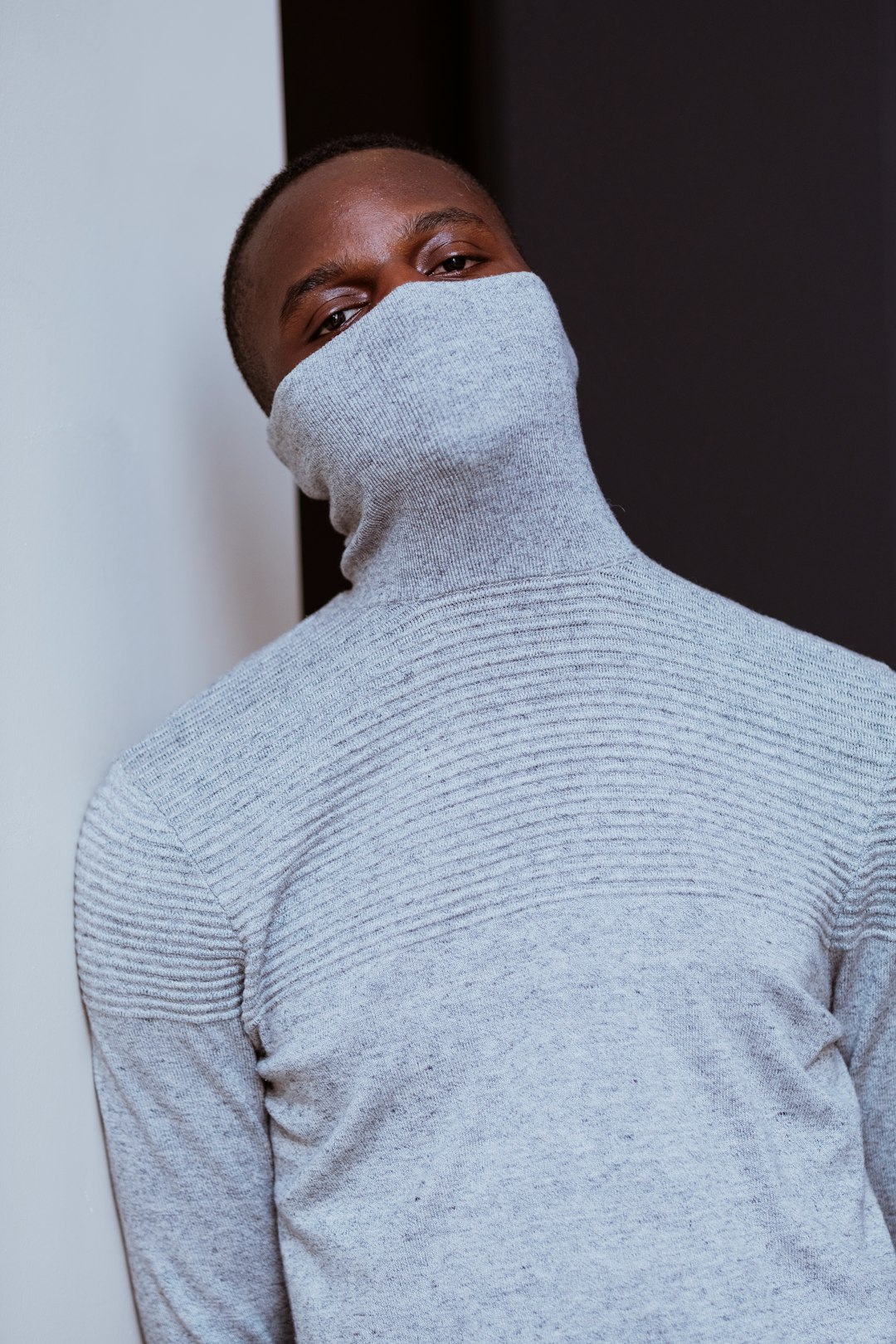 man in gray turtleneck sweater