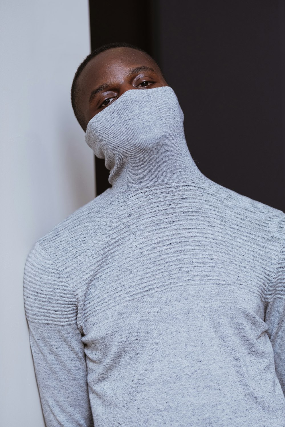 man in gray turtleneck sweater