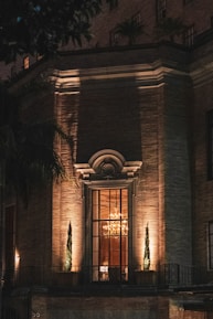 brown wooden door in brown concrete building