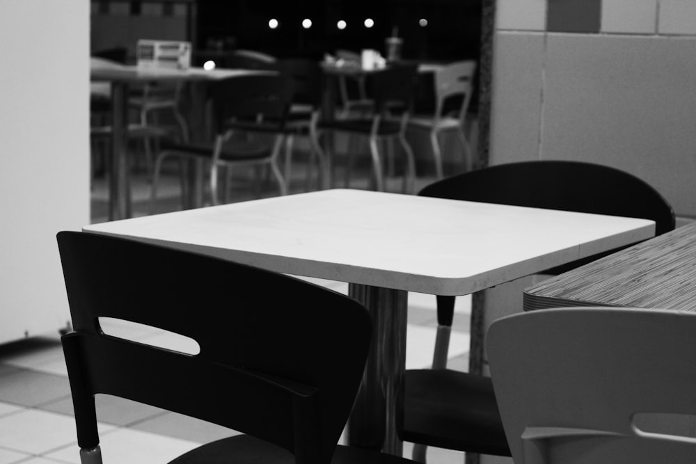 black and white chairs and table
