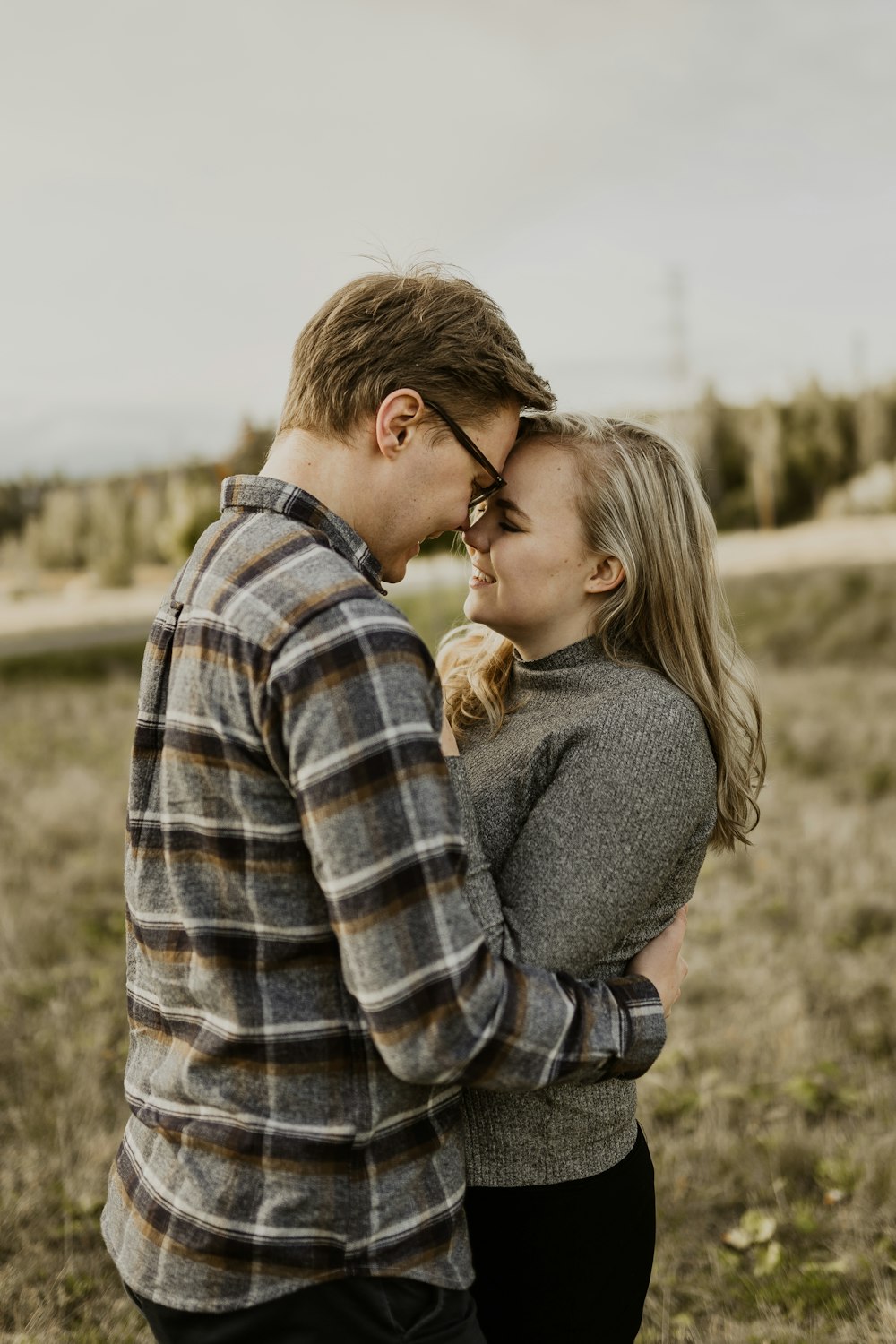 man and woman kissing during daytime