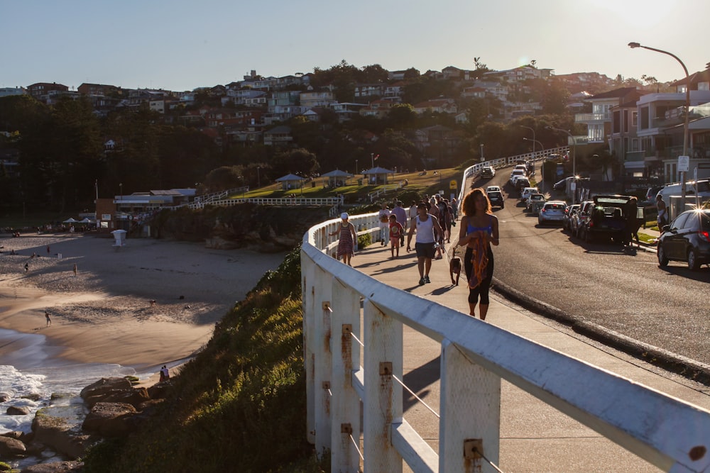 people walking on white bridge during daytime