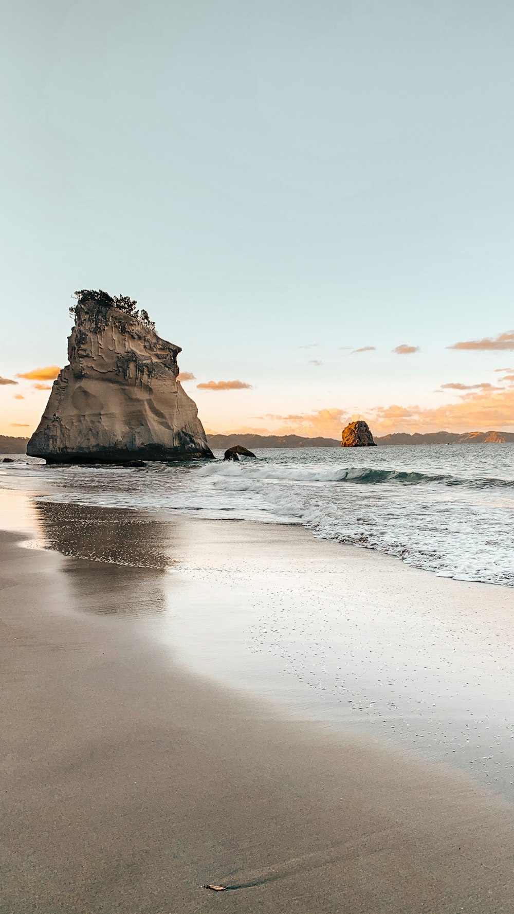 brown rock formation on sea shore during daytime