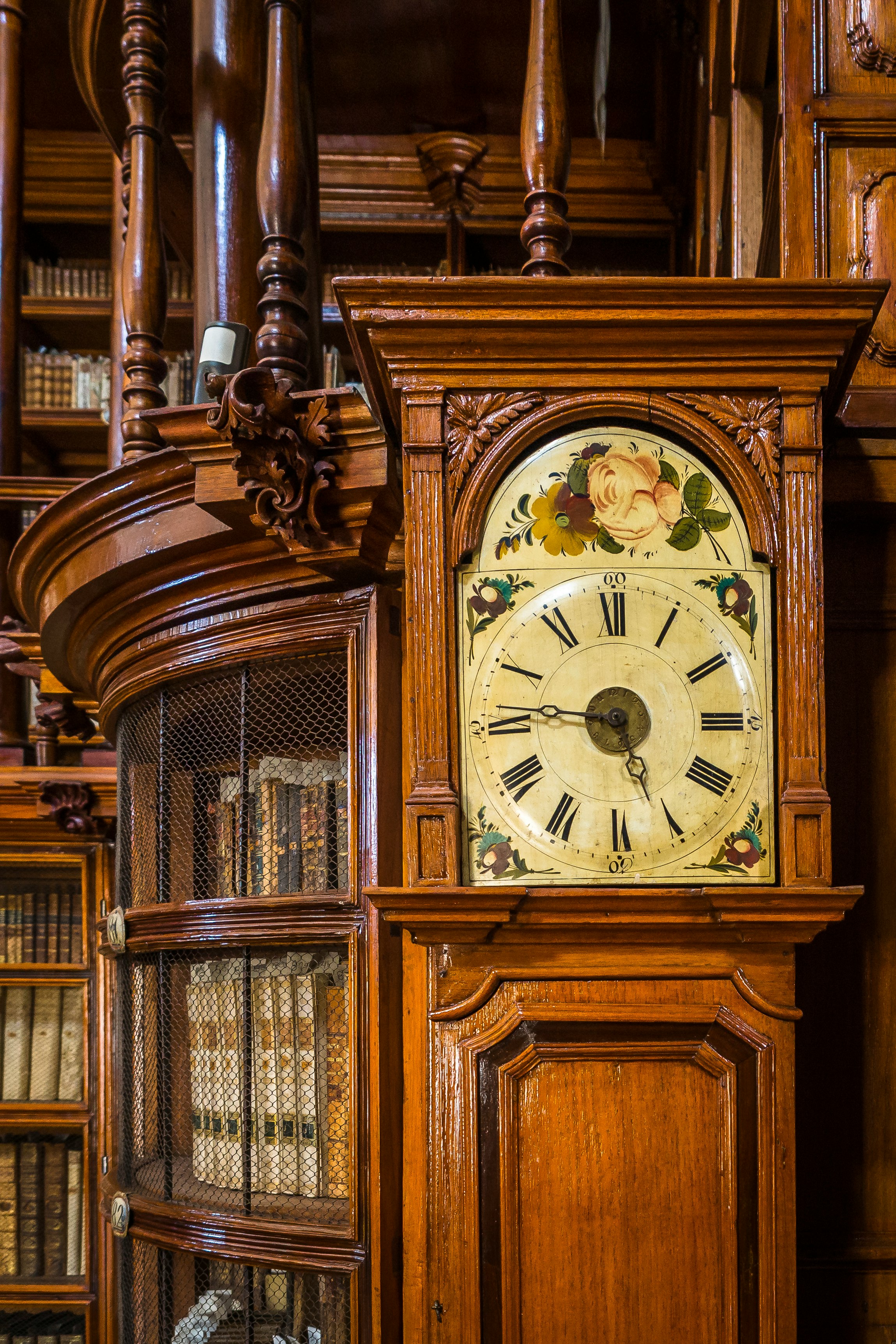 brown wooden framed analog clock at 10 30