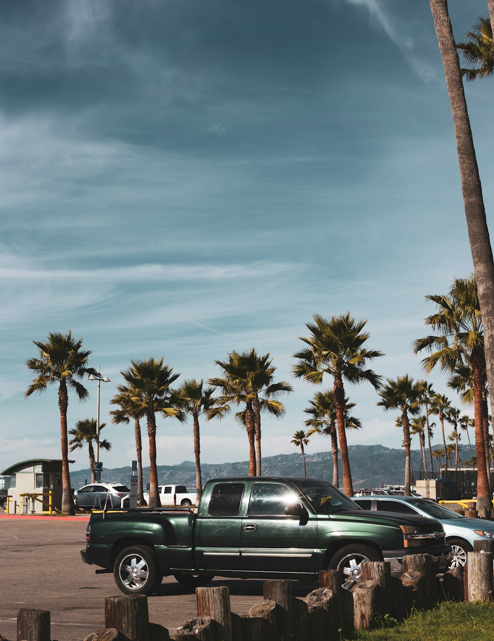 black sedan parked on parking lot during daytime