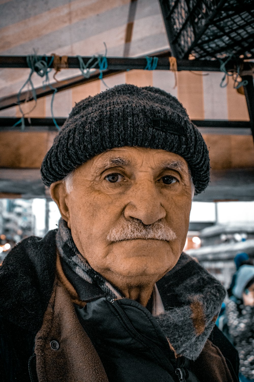 man in black knit cap and black jacket