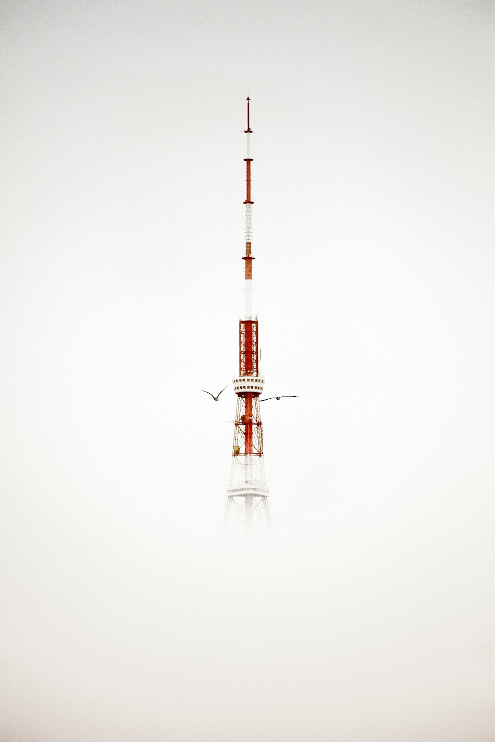 red and white tower under white sky