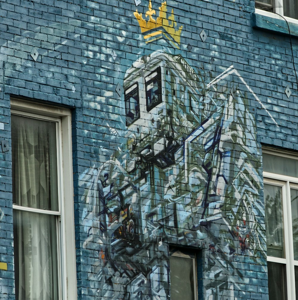 yellow and black star on gray brick building