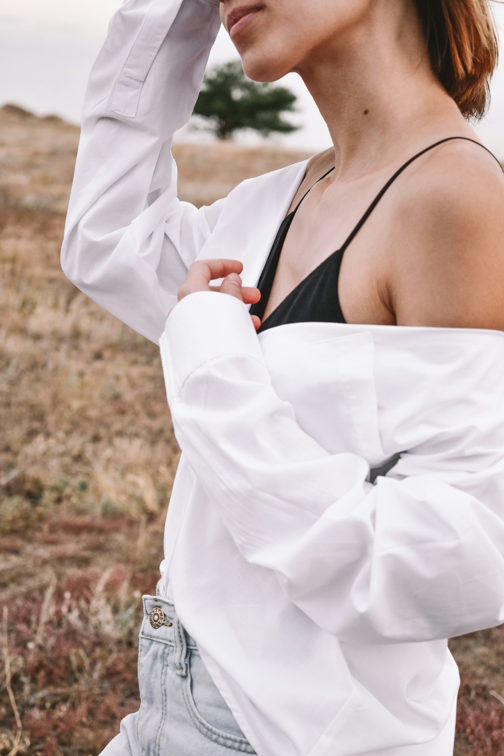 woman in white blazer and black brassiere