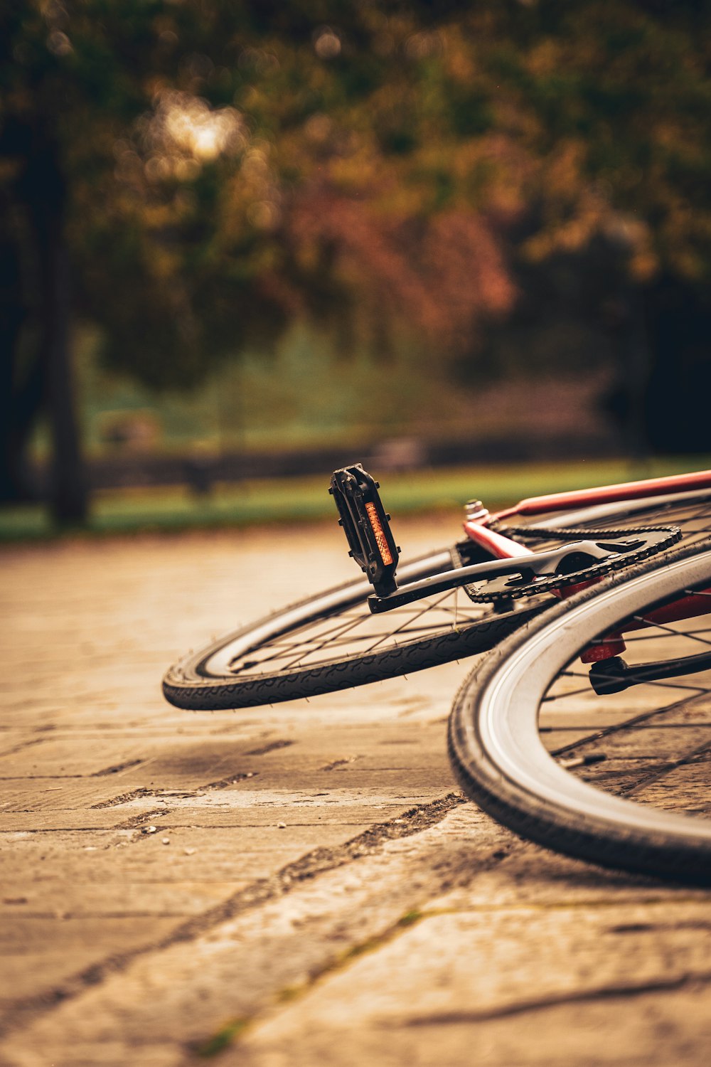 red and black bicycle on brown concrete floor