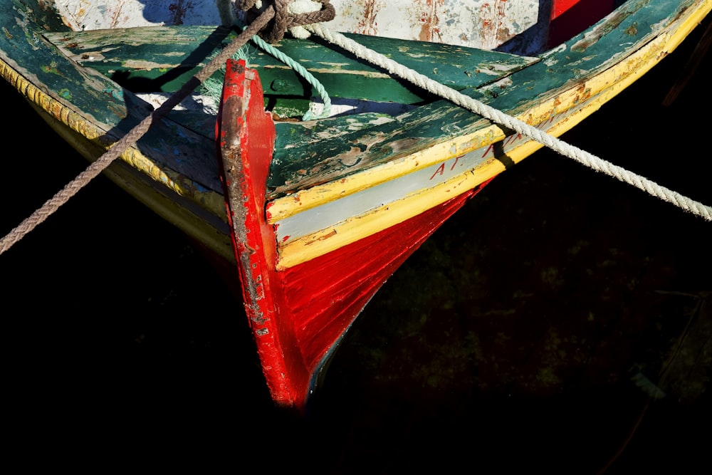 red and blue boat on water