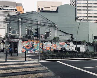 Before and after images showing revitalization of an old building’s exterior paint