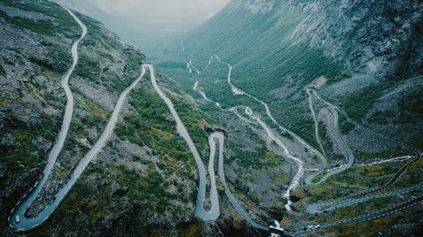 aerial view of river between mountains during daytime