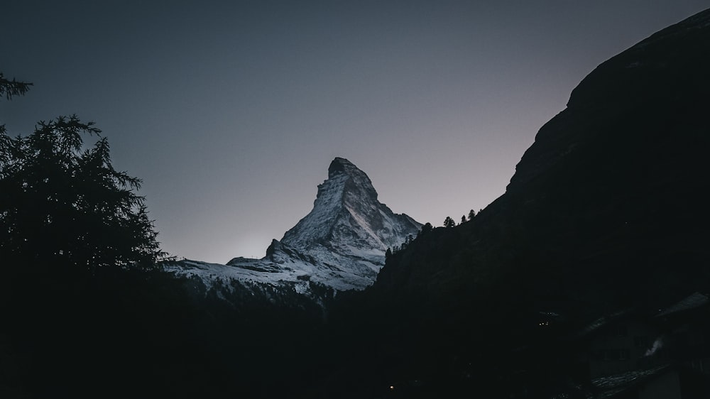 snow covered mountain during daytime