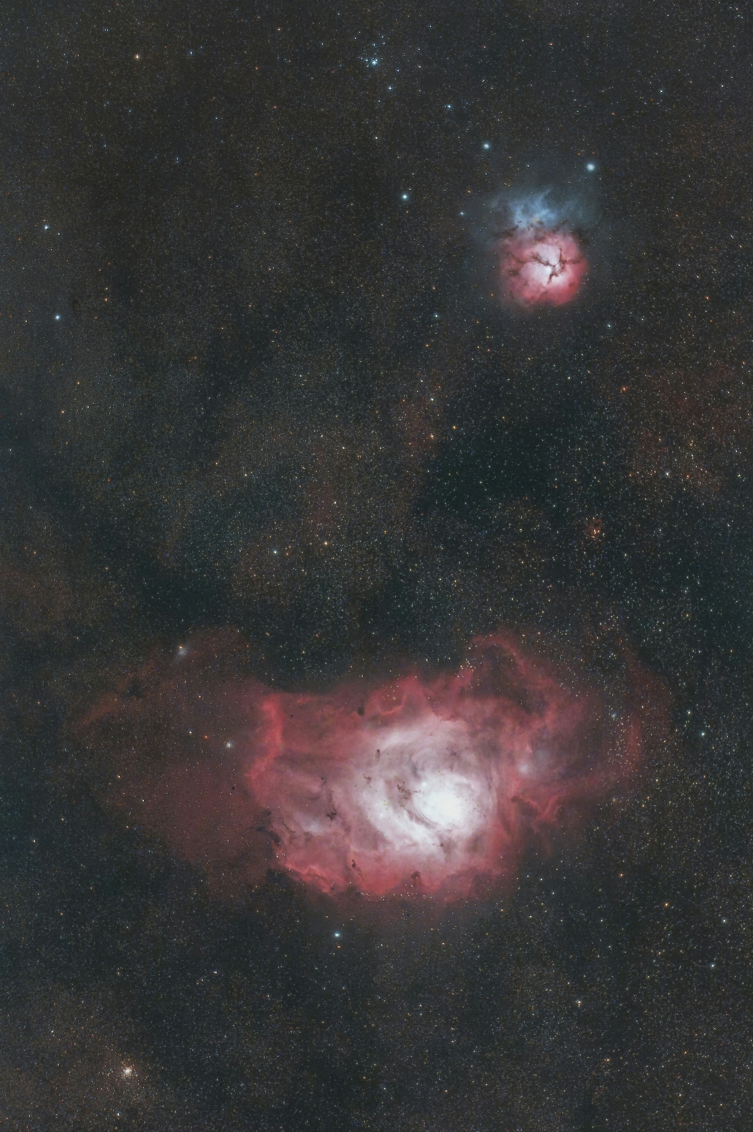 The Lagoon and Trifid nebulas captured with a telescope and a defiltered camera.