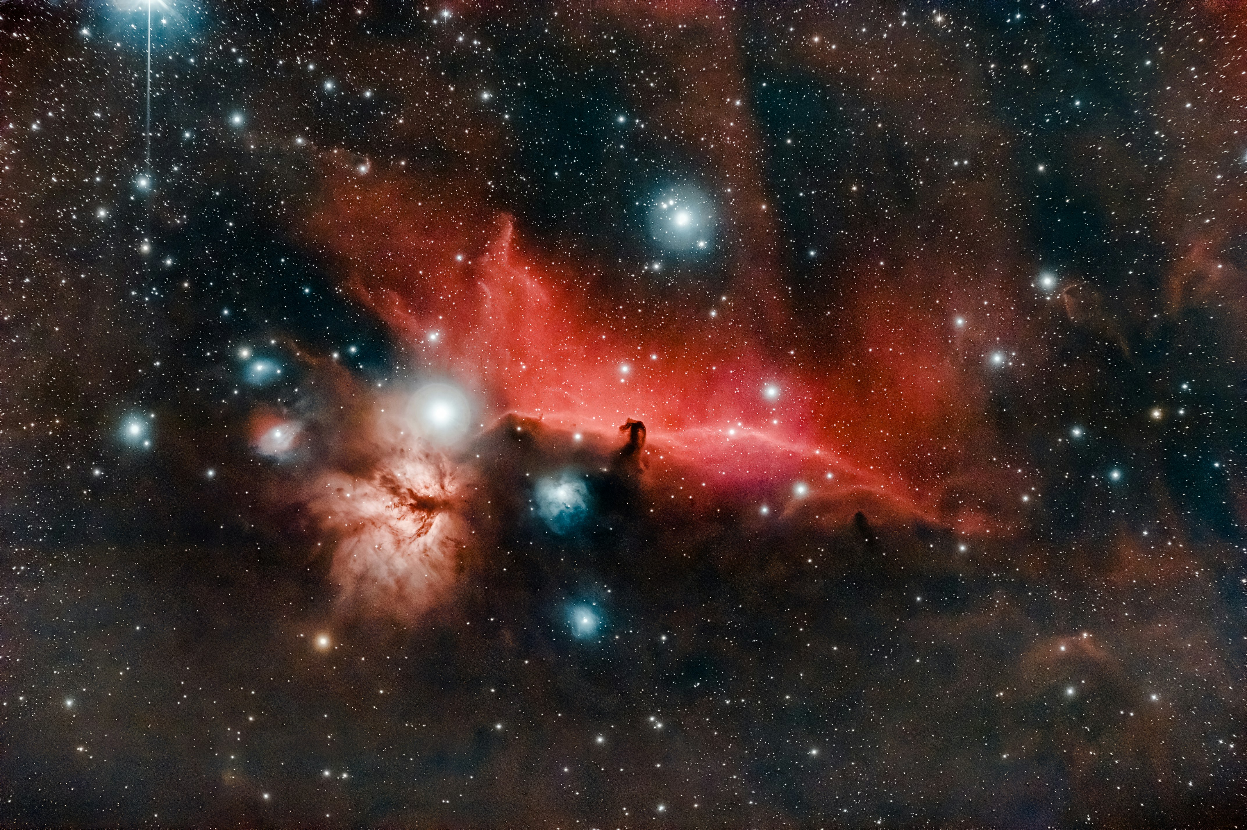 great photo recipe,how to photograph the horsehead and flame nebulas captured with a telescope and a defiltered camera.; red and black galaxy with stars
