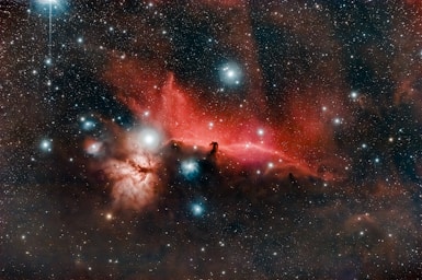 astrophotography,how to photograph the horsehead and flame nebulas captured with a telescope and a defiltered camera.; red and black galaxy with stars