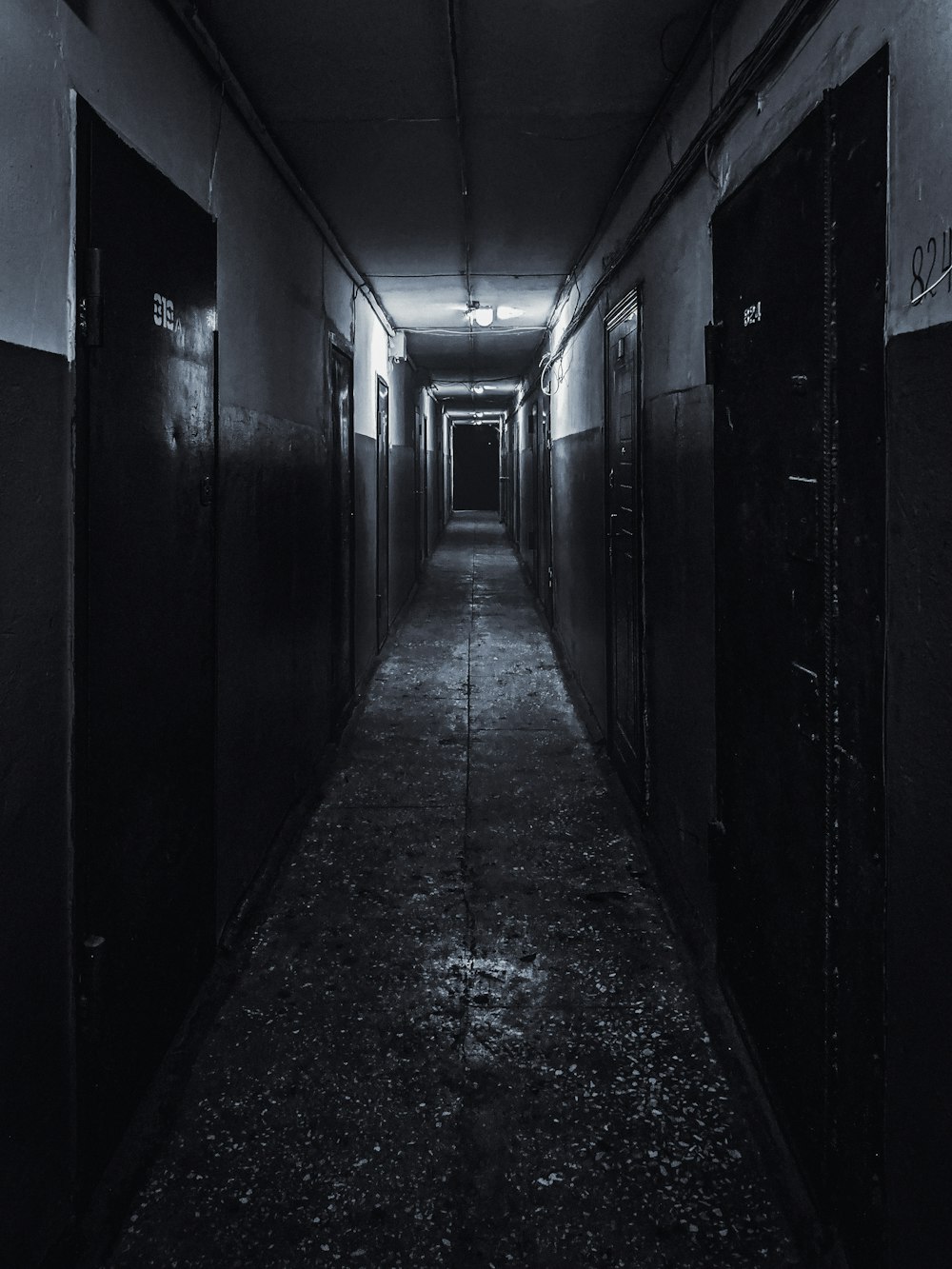 black wooden door in a hallway