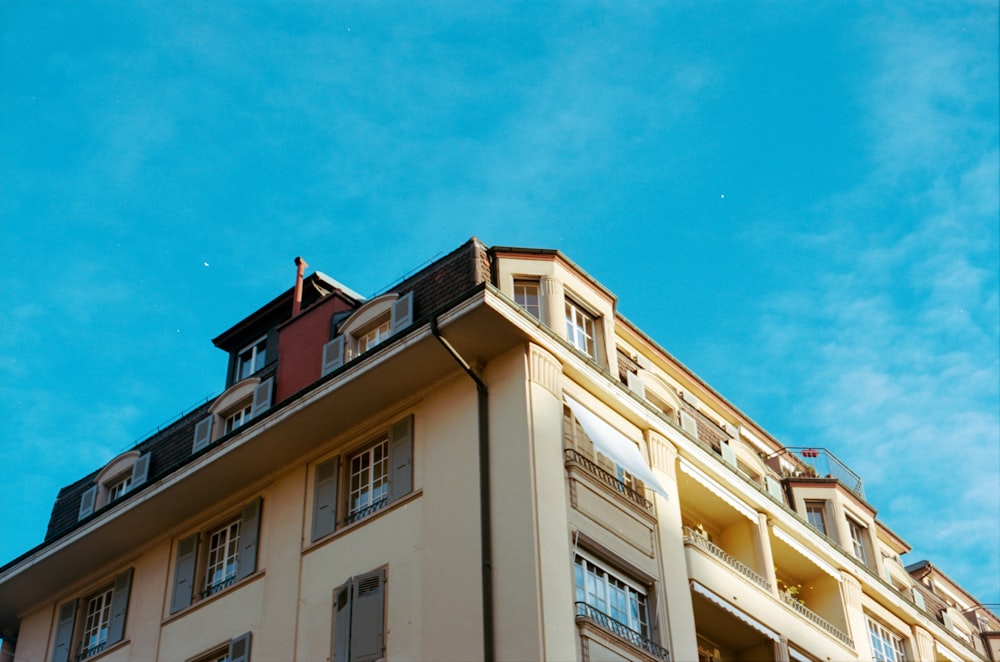 beige concrete building under blue sky during daytime