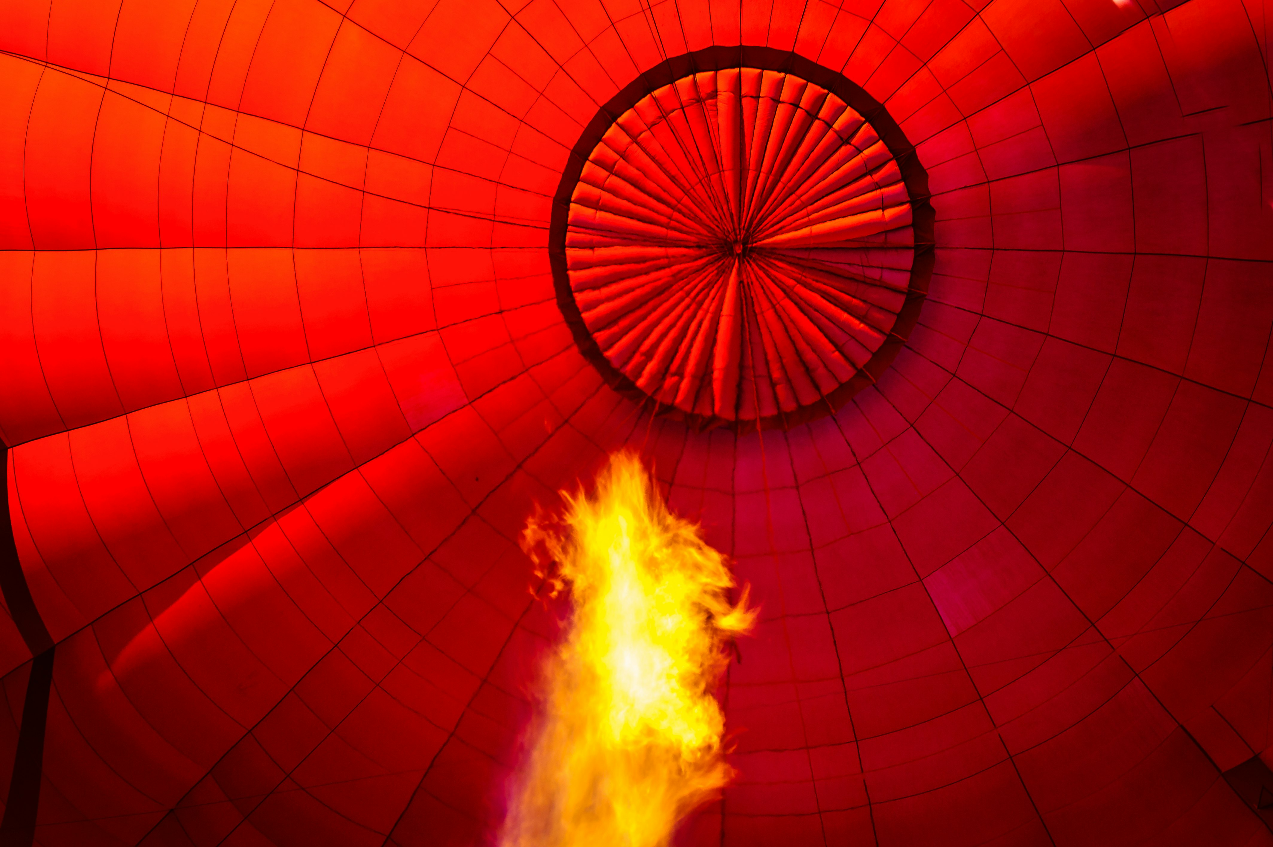 red hot air balloon with fire