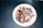 Close-up of smoky grilled octopus tentacles garnished with fresh parsley and lemon wedges on a white plate