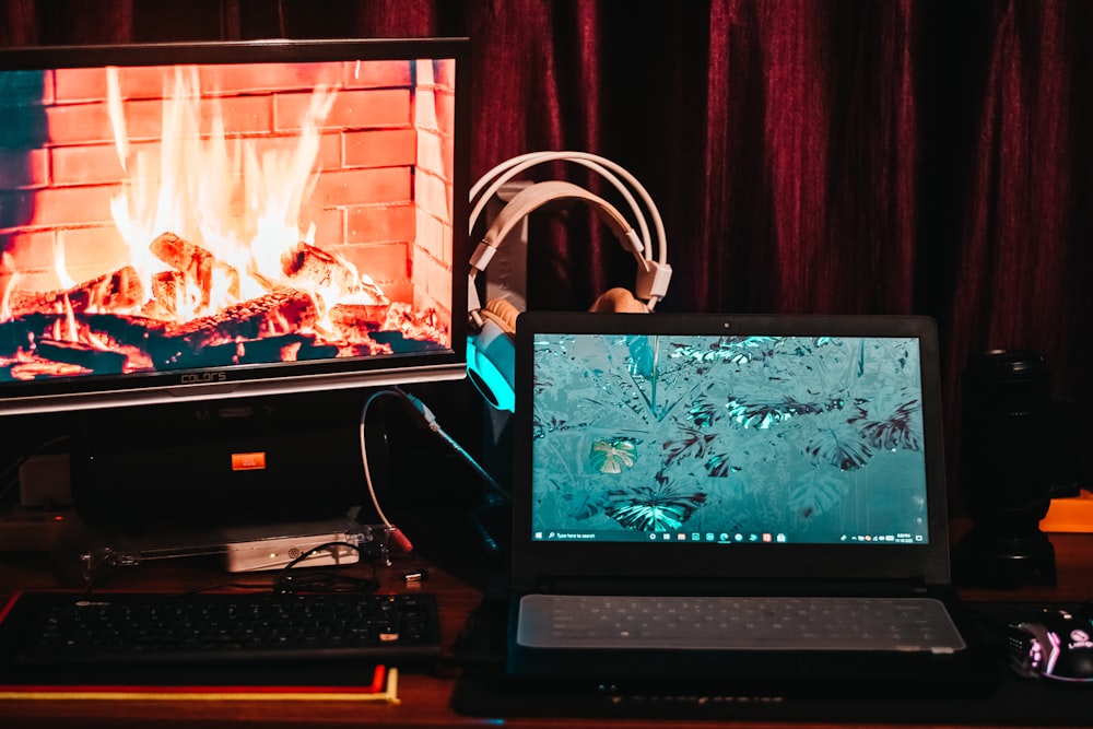 black flat screen computer monitor beside black computer keyboard