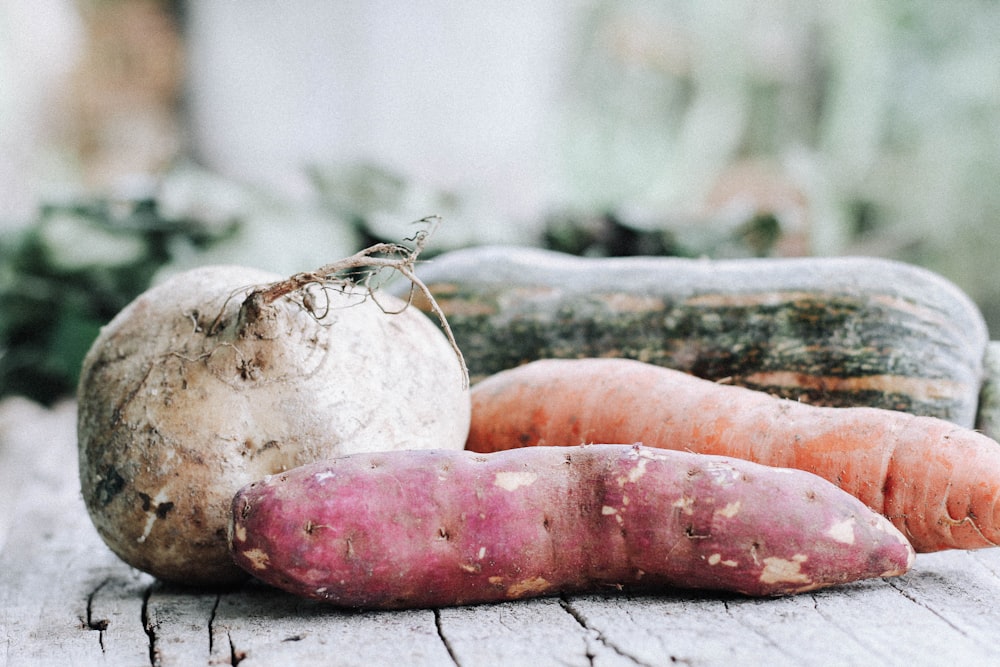 orange carrots on brown wooden table