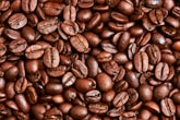 brown coffee beans on brown wooden table