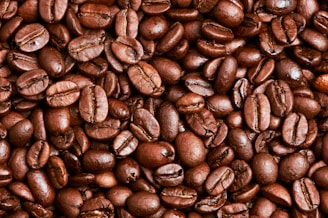 brown coffee beans on brown wooden table