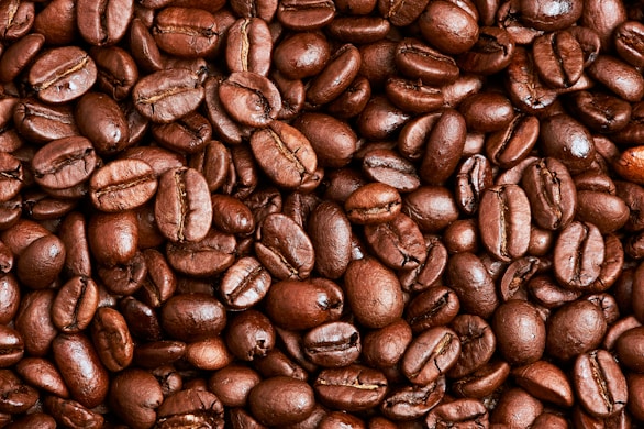brown coffee beans on brown wooden table