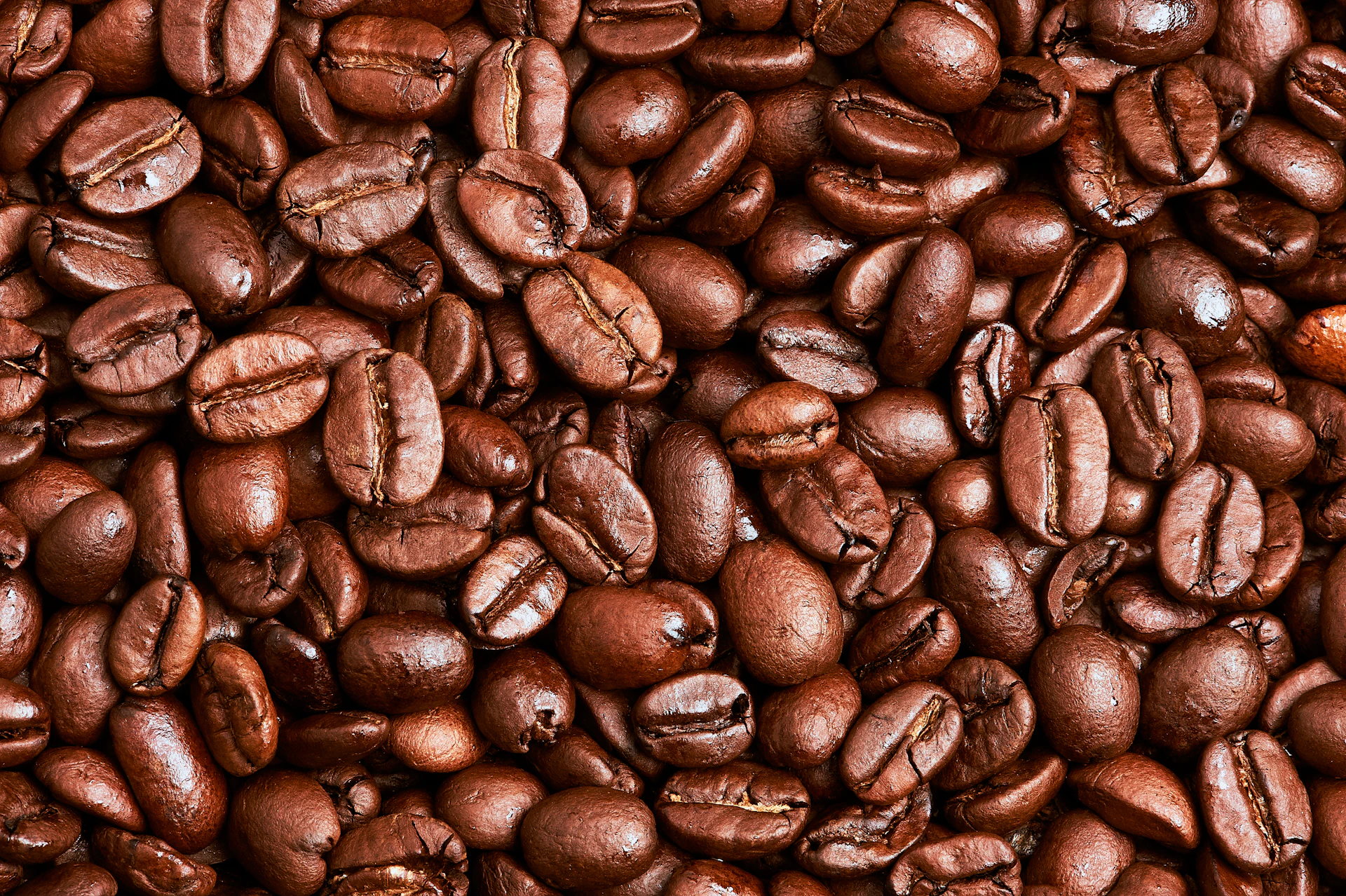 brown coffee beans on brown wooden table