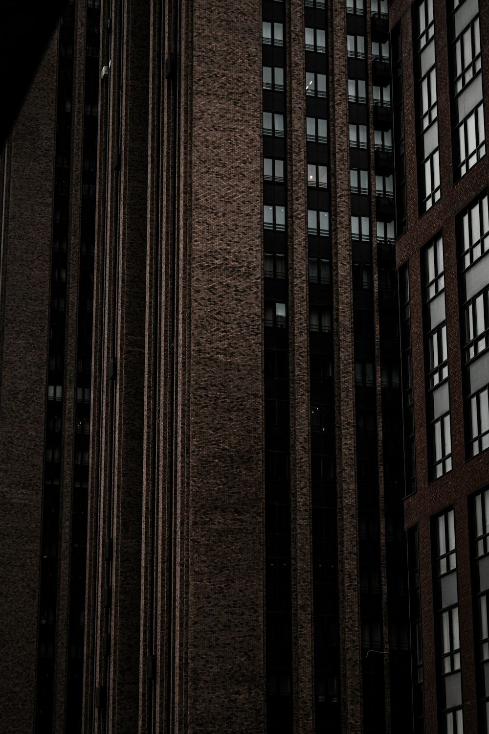 brown brick building with glass windows