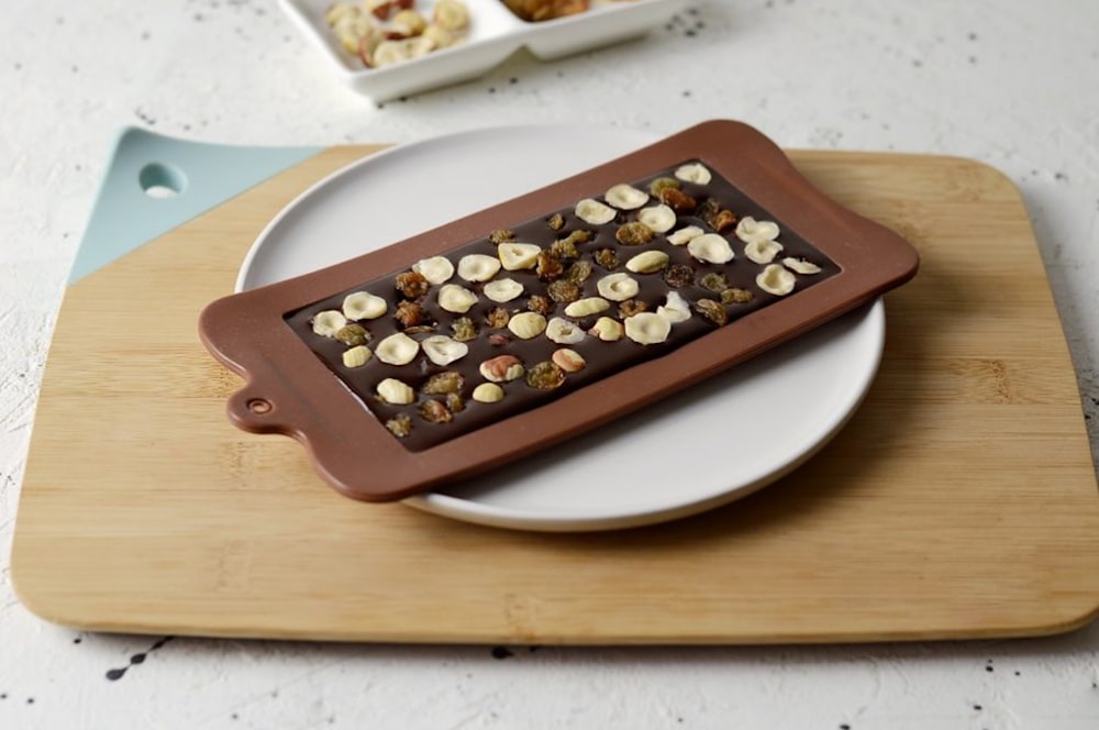 white and brown round food on white ceramic plate