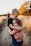 boy in black t-shirt hugging girl in red and white polka dot dress