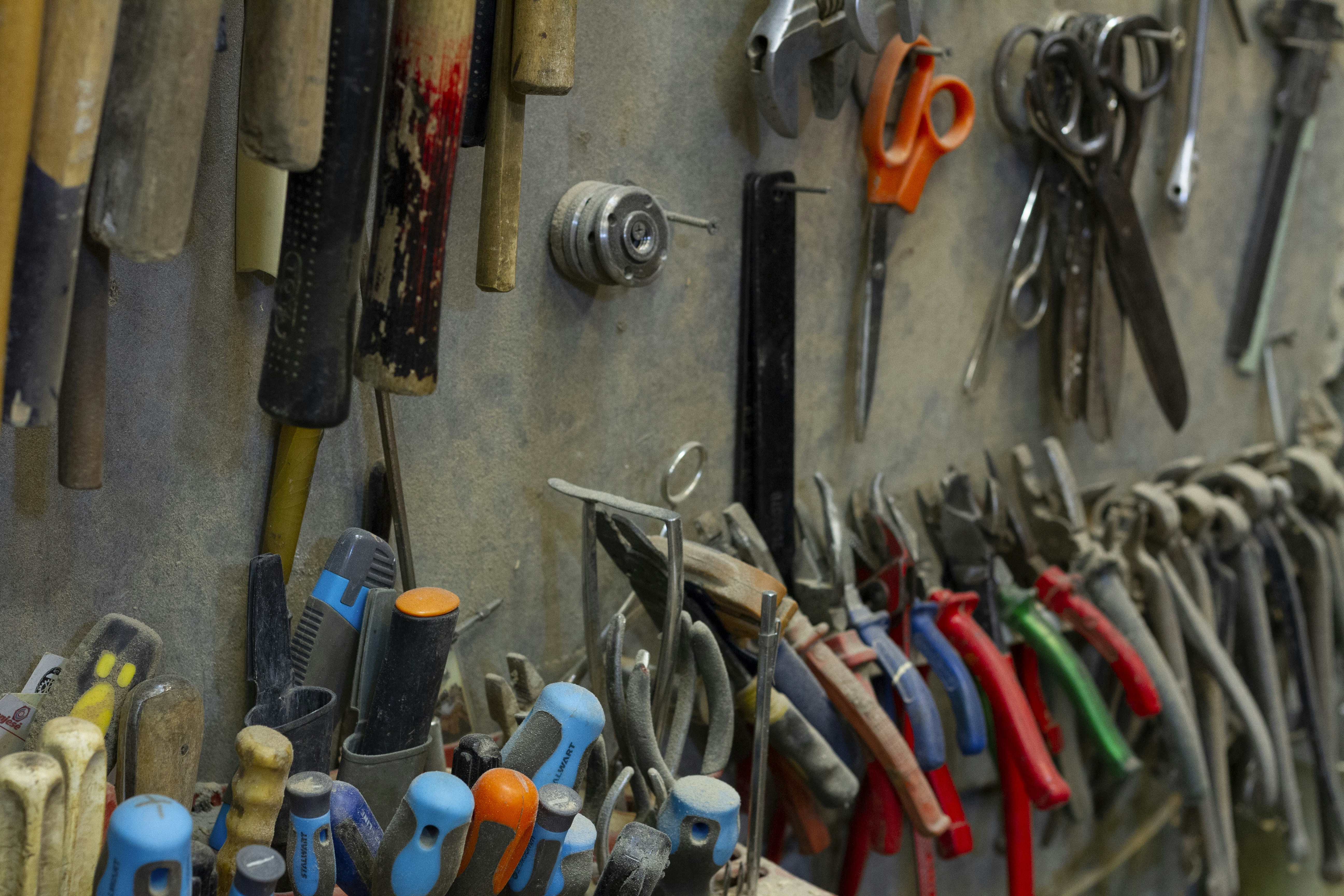 red and blue handle pliers