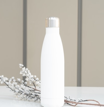 white bottle on white table