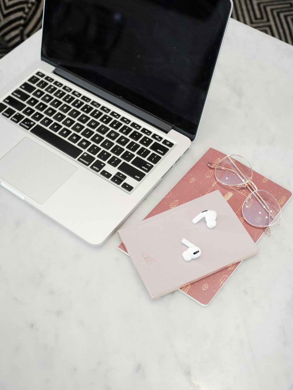 macbook pro on white table