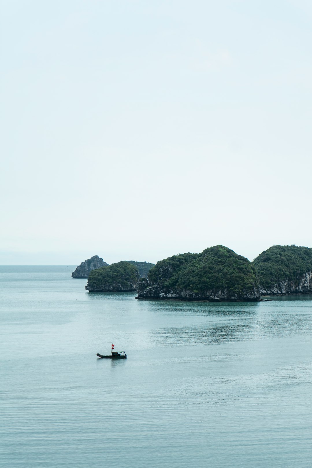 person riding on boat on sea during daytime