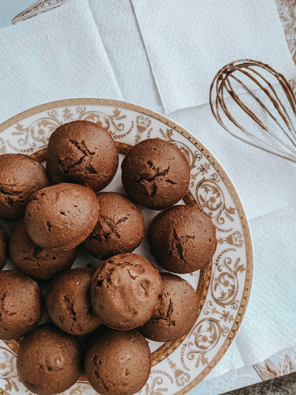 brown cookies on blue and white ceramic plate