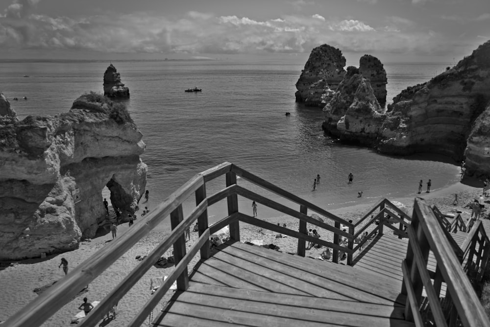 grayscale photo of wooden dock