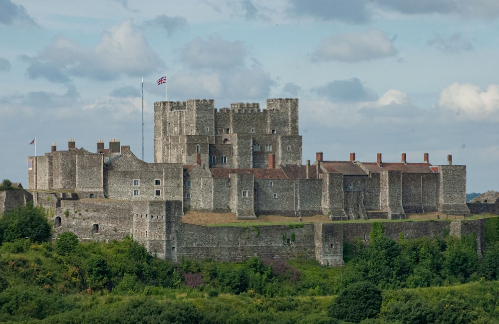 brown concrete castle under white clouds during daytime