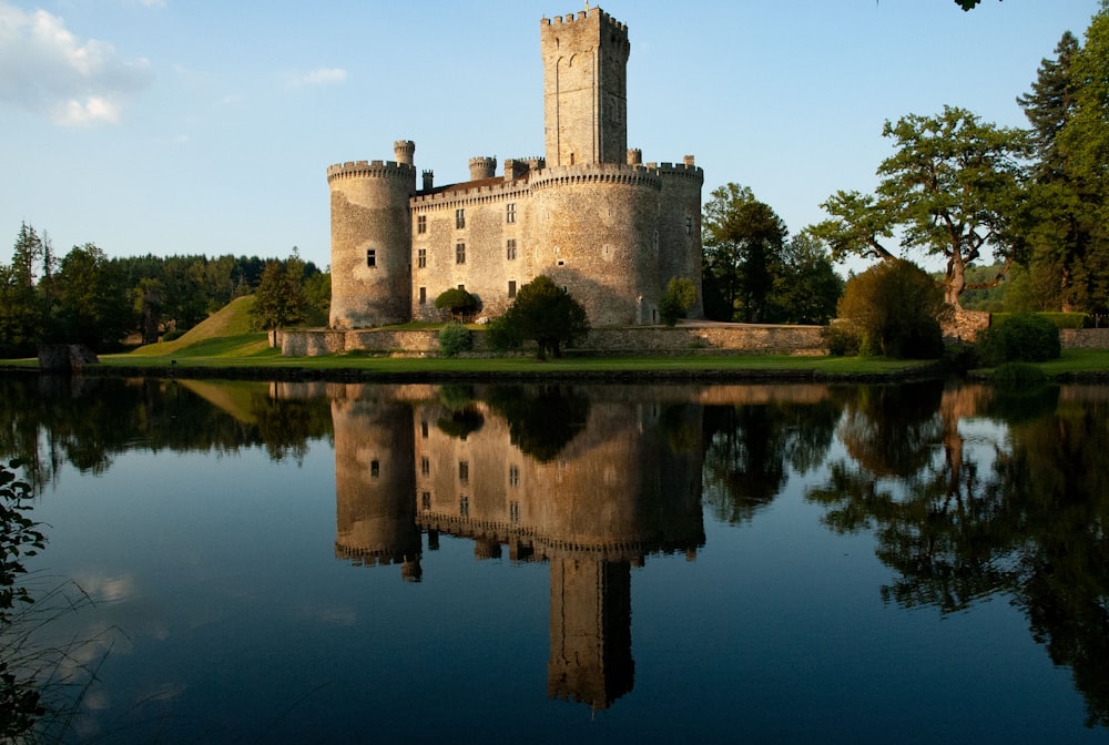 brown concrete castle on water