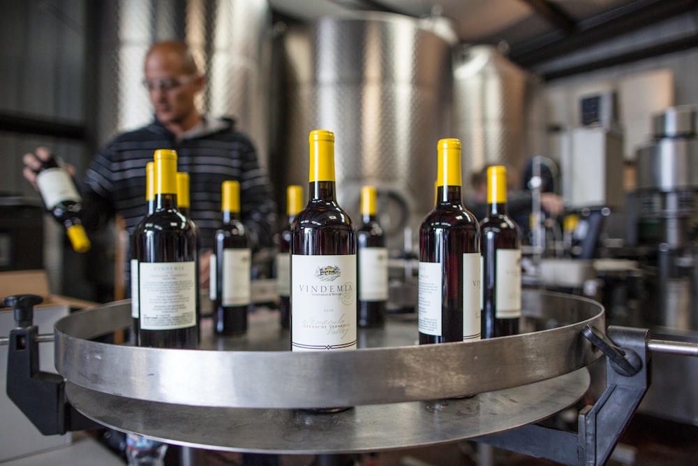 wine bottles on stainless steel round table