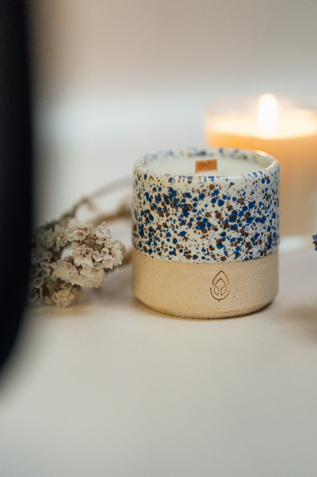white and blue candle holder