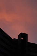 Sunset view of a completed cement structure glowing warmly in the evening light.